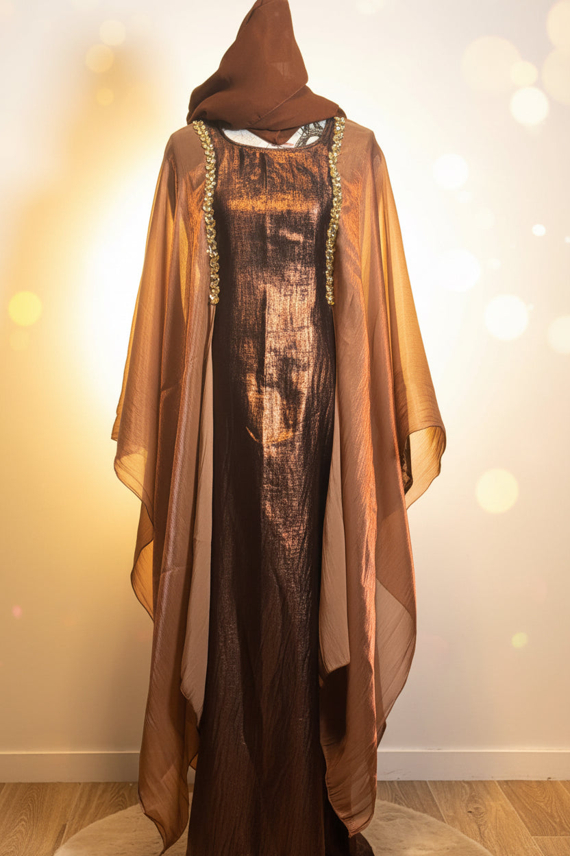 Elegant brown abaya with sheer flowing sleeves and a metallic textured front panel with decorative trim.