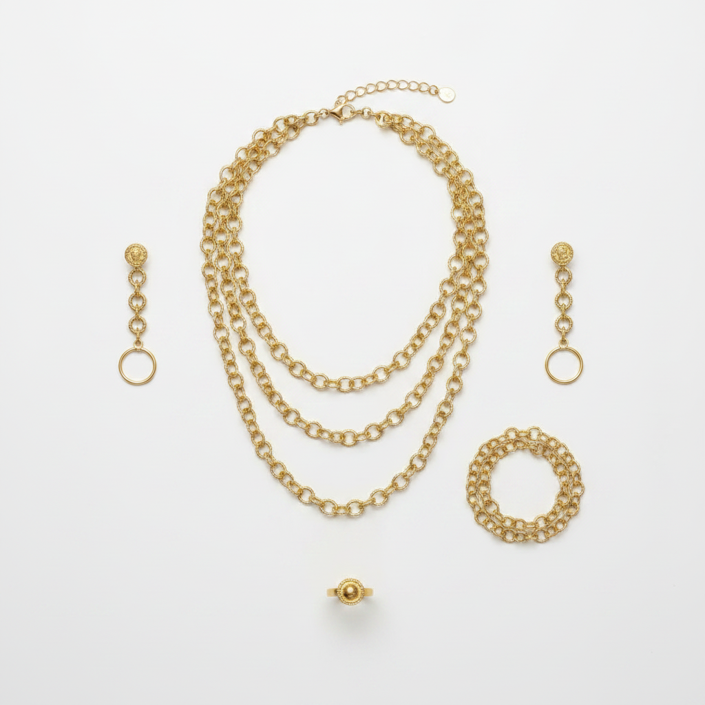 Parure Harmonie plaqué or - collier, bracelet, boucles d'oreilles et bague plaqué or posés à plat