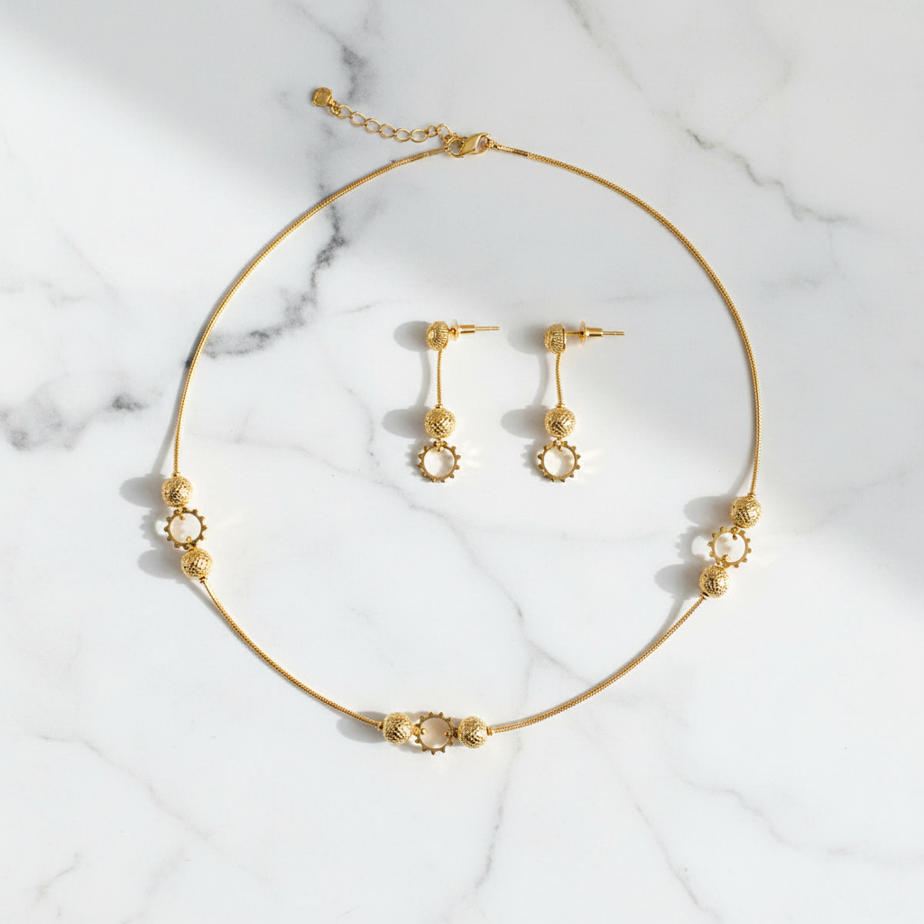 Parure collier et boucles d'oreilles femme motif boule – vue à plat
